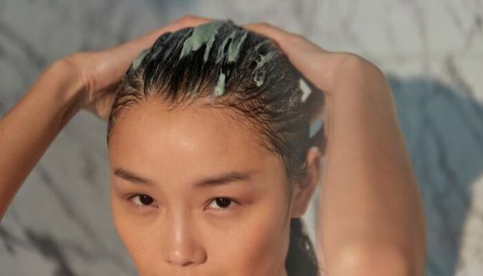 wash hair with a nourishing shampoo