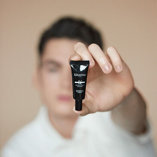 Man holding Densifique Bodifying Scalp Treatment