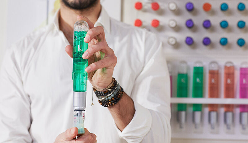 person holding fusio-dose booster