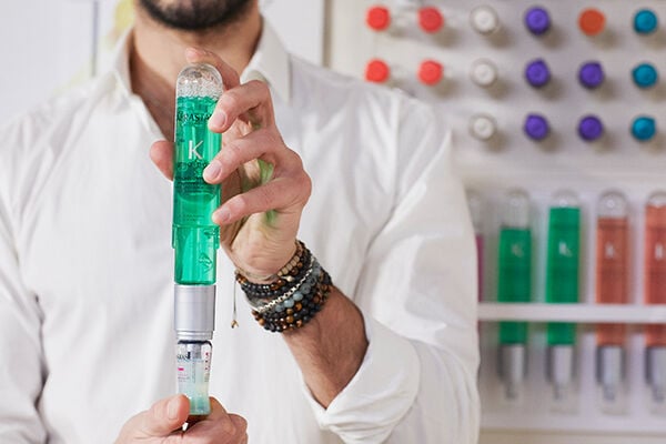 person holding fusio-dose booster