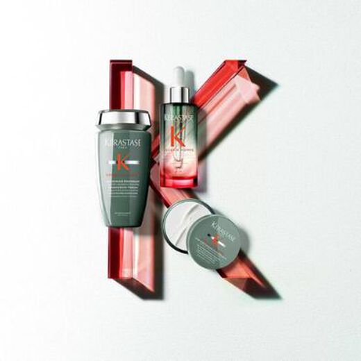 Kerastase mens model holding Genesis Clay product
